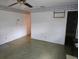 A glimpse into the living room featuring outdated decor and fixtures awaiting modernization and personalization at 16880 Se 63Rd Ln, Ocklawaha, FL 32179