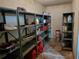 Unfinished basement with concrete walls and floors, and metal shelving units for storage at 1725 Turtle Hill Rd, Enterprise, FL 32725
