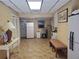 Finished basement area with tiled floor, laundry area with sink, storage, and bench seating at 1725 Turtle Hill Rd, Enterprise, FL 32725