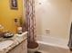 Cozy bathroom featuring tiled bathtub, shower, and granite vanity top at 1725 Turtle Hill Rd, Enterprise, FL 32725