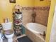 The bathroom has a tile surround tub, tile floors, and built-in shelving at 1725 Turtle Hill Rd, Enterprise, FL 32725