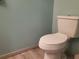 The half bathroom features a standard toilet on light colored tile flooring at 1725 Turtle Hill Rd, Enterprise, FL 32725