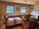 The bedroom has hardwood floors and two windows for natural light at 1725 Turtle Hill Rd, Enterprise, FL 32725