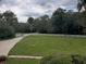 Expansive front yard with lush lawn and white picket fence offering privacy and curb appeal at 1725 Turtle Hill Rd, Enterprise, FL 32725