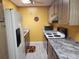 Practical kitchen featuring Formica countertops and modern appliances at 1725 Turtle Hill Rd, Enterprise, FL 32725