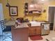 Kitchen featuring wood cabinets, granite countertops, a stainless steel dishwasher and a farmhouse sink at 1725 Turtle Hill Rd, Enterprise, FL 32725