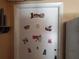 Laundry closet door adorned with vintage laundry-themed decals and signs at 1725 Turtle Hill Rd, Enterprise, FL 32725