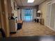 The basement living room features an exit to the pool, tile flooring, and a closet at 1725 Turtle Hill Rd, Enterprise, FL 32725