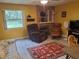 Relaxing living room with natural light, a fireplace, and comfortable seating at 1725 Turtle Hill Rd, Enterprise, FL 32725