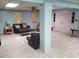 The spacious living room has light blue walls, tile flooring, and two leather sofas at 1725 Turtle Hill Rd, Enterprise, FL 32725