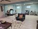 This open living room has light blue walls, tile flooring, and exercise equipment at 1725 Turtle Hill Rd, Enterprise, FL 32725