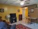 Comfortable living room with TV and vintage furniture at 1725 Turtle Hill Rd, Enterprise, FL 32725