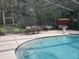 Pool with patio furniture, poolside statues, and a covered seating area with a swing at 1725 Turtle Hill Rd, Enterprise, FL 32725