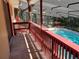 View of swimming pool from deck with shade covering at 1725 Turtle Hill Rd, Enterprise, FL 32725