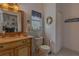 Charming bathroom with custom vanity and beach-themed decor at 18 Foxfords, Ormond Beach, FL 32174