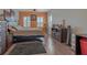 Bedroom with modern bed frame, stylish gray rug, and large windows at 18 Foxfords, Ormond Beach, FL 32174