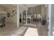 Bright and inviting open-concept home featuring tile flooring and soaring ceilings, connecting the living spaces seamlessly at 18 Foxfords, Ormond Beach, FL 32174