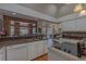 Open-concept kitchen features stainless steel appliances and a breakfast bar at 18 Foxfords, Ormond Beach, FL 32174