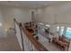 A view from the upper floor looking down to the living room, dining room, wet bar, and pool area at 18 Foxfords, Ormond Beach, FL 32174