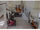 Spacious living room viewed from above featuring spiral staircase, wet bar, and large sectional couch at 18 Foxfords, Ormond Beach, FL 32174