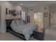 Large main bedroom features neutral walls, wood-look floors, and an ensuite bathroom at 18 Foxfords, Ormond Beach, FL 32174