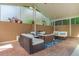 Covered patio with comfortable seating, a fire pit, and privacy screen at 18 Foxfords, Ormond Beach, FL 32174