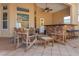 Covered outdoor patio with ceiling fan, brick bar and grill, and multiple seating areas at 18 Foxfords, Ormond Beach, FL 32174
