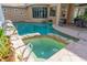 Indoor pool with spa, surrounded by tile, with an outdoor seating area and window view at 18 Foxfords, Ormond Beach, FL 32174