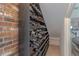 Close-up of a custom wine rack with brick background for storing your favorite wines at 18 Foxfords, Ormond Beach, FL 32174