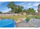 Spacious backyard with an above-ground pool, storage shed, and ample space for outdoor activities and gardening at 1904 Viking Ave, Deltona, FL 32725