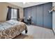 Bedroom featuring a modern style with a sleek desk, chair, and paneled accent wall at 1904 Viking Ave, Deltona, FL 32725