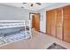 Bright bedroom featuring a bunk bed, ceiling fan and closet with slat doors at 1904 Viking Ave, Deltona, FL 32725