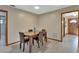 Cozy dining room with hardwood floors, a classic wooden table, and seating for four at 1904 Viking Ave, Deltona, FL 32725