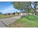 Charming single-story home with a brick facade, attached garage, and a well-manicured front lawn and driveway at 1904 Viking Ave, Deltona, FL 32725