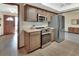 Modern kitchen featuring stainless steel appliances, and stylish cabinets that offer ample storage space at 1904 Viking Ave, Deltona, FL 32725