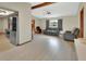 The open-concept living room offers hardwood floors, large windows, and natural light at 1904 Viking Ave, Deltona, FL 32725