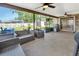 Inviting sunroom with comfortable seating and views of the backyard with a shed and above-ground pool at 1904 Viking Ave, Deltona, FL 32725