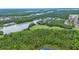 Aerial view highlighting the proximity to lush green forests and a vast lake, promoting outdoor enjoyment at 191 Sedona Cir, Daytona Beach, FL 32124