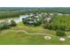 Beautiful aerial view of a home located on a lush golf course near a tranquil lake at 191 Sedona Cir, Daytona Beach, FL 32124