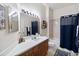 Bright bathroom featuring a vanity and shower-tub combination at 191 Sedona Cir, Daytona Beach, FL 32124