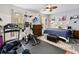 Bedroom featuring an in-home gym space, ceiling fan and natural light at 191 Sedona Cir, Daytona Beach, FL 32124