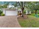 Well-maintained single Gathering home featuring lush landscaping and a brick driveway at 191 Sedona Cir, Daytona Beach, FL 32124