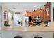 Kitchen with stainless steel appliances, wooden cabinets, and a breakfast bar at 191 Sedona Cir, Daytona Beach, FL 32124
