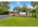 A front lawn view of LPGA Headquarters with a manicured lawn and sign at 191 Sedona Cir, Daytona Beach, FL 32124