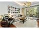 Bright living room features sliding glass doors, recessed lighting, and a decorative ceiling fan at 191 Sedona Cir, Daytona Beach, FL 32124