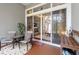 Relaxing outdoor patio featuring a seating area, view of the living room through sliding glass door, and stylish decor at 191 Sedona Cir, Daytona Beach, FL 32124
