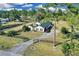 Aerial view of home with fenced yard, mature trees, and a long driveway at 19343 Moorgate St, Orlando, FL 32833