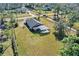 Aerial view of a home with a large lot, screened-in pool, and fenced-in backyard with mature trees at 19343 Moorgate St, Orlando, FL 32833