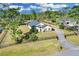 Aerial view of home with fenced yard, mature trees, and a long driveway at 19343 Moorgate St, Orlando, FL 32833