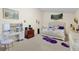 Cozy bedroom featuring plush carpeting, a decorative bed frame, and ample vanity space at 19343 Moorgate St, Orlando, FL 32833
